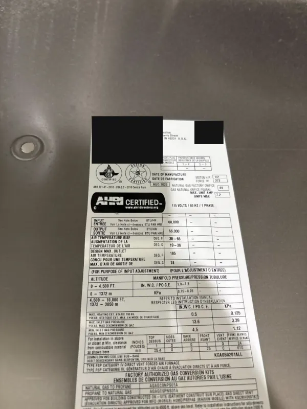 A phone photo of the rating label inside a gas furnace